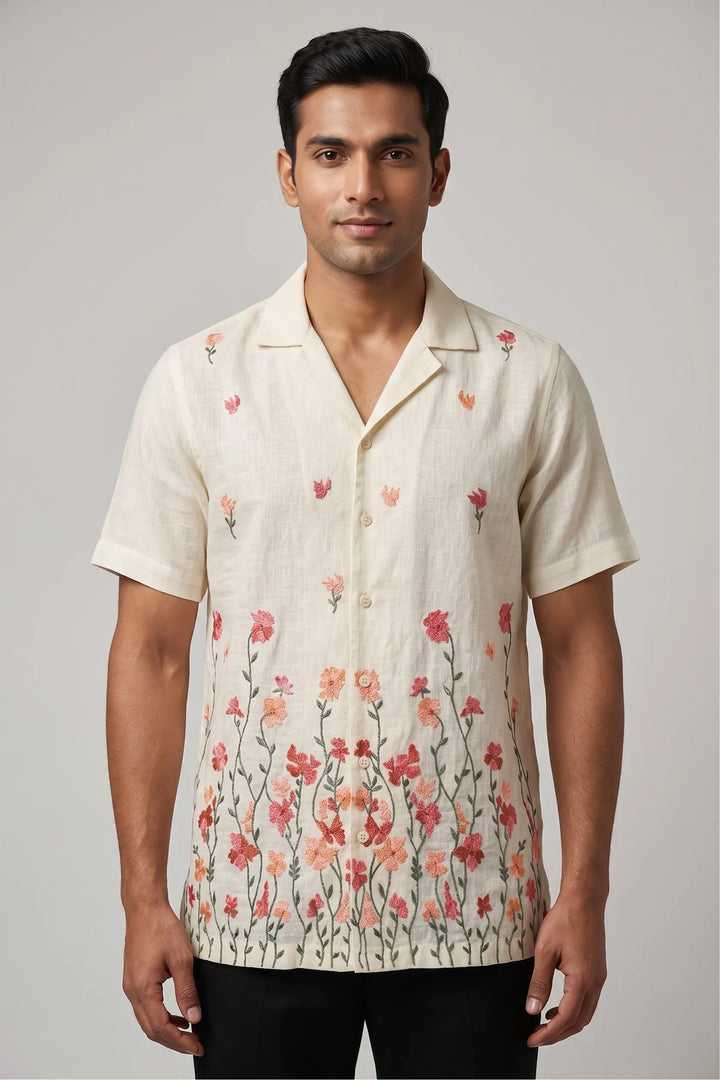 Linen shirt with artisan thread embroidery — floral stems rising from the hem — Meadow by HILO DESIGN