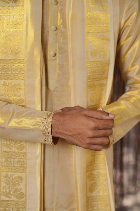 Gold zari detail on a pattu kurta sleeve